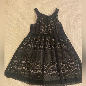 Black eyelet dress over nude color fabric. Size 12 and worn once!